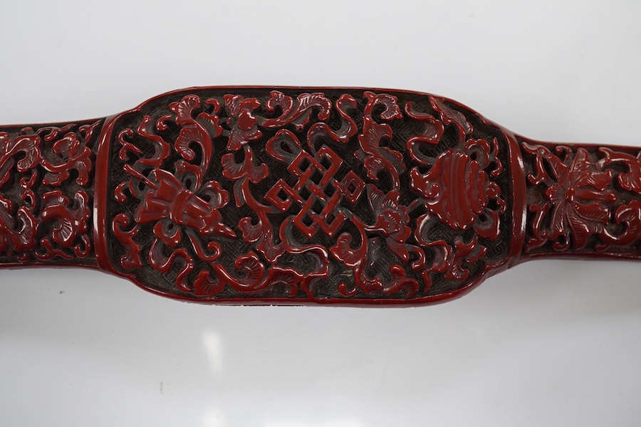 A Chinese red lacquered Ruyi sceptre, 41cm. Condition - fair to good